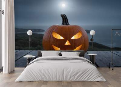 One spooky halloween pumpkin, Jack O Lantern, with an evil face and eyes on a wooden bench, table with a misty gray coastal night background Wall mural